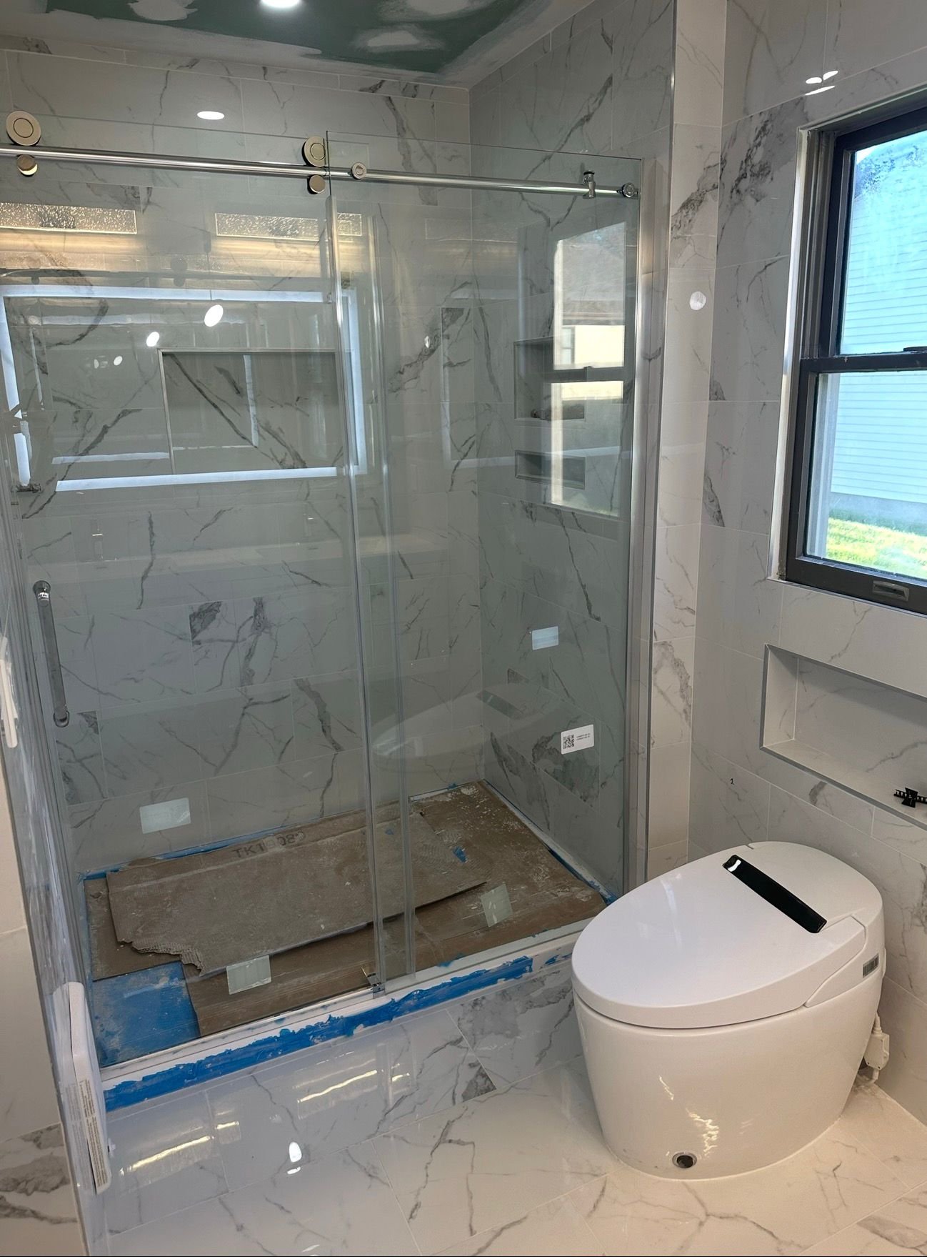 Bathroom remodel with tiled shower and fixtures by Vega Construction in Ocean County, New Jersey